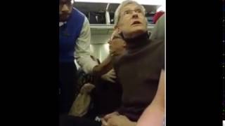 Woman berating Trump fan is kicked off plane  Passengers cheer [upl. by Eiluj]