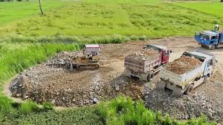 Update project Dump Truck pouring rock into rice field to making foundation house [upl. by Vevay]