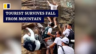 Chinese tourist survives fall from steep mountain steps [upl. by Asyal]