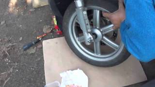 FRONT WHEEL REMOVAL INSTALLATION APRILIA SPORTCITY 125 [upl. by Naivart300]