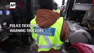 Police ticketing warning truckers to leave Ottawa [upl. by Celik]