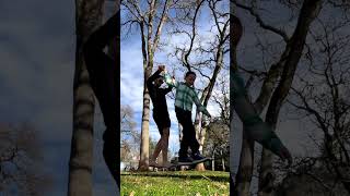 Man With One Kid on His Shoulders Holds Hands With Another Kid and Crosses Slack Line  14013192 [upl. by Ramunni385]