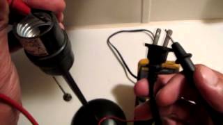 Using a multimeter check wiring on a lamp [upl. by Siraved]