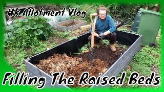 🥕 🥔 🍅 Filling The Raised Bed  UK Allotment Vlog [upl. by Nnylatsyrk]