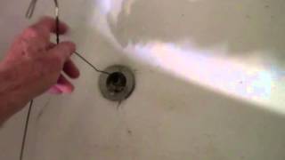 how to unstop a tub drain wit clothes hanger [upl. by Atiraj776]