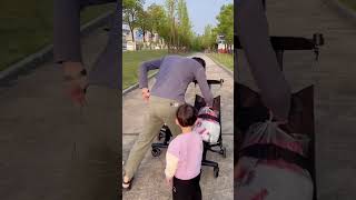 This dad is too lazy He actually puts things on the stroller and lets the baby push him and play w [upl. by Marshall]