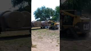 Skidsteer Hay Bale Moving  with caterpillar tracked skid loader  skid steer cat [upl. by Latea819]