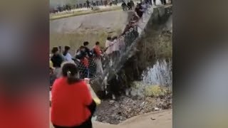 China Suspension bridge collapses after tourists shook it for fun [upl. by Eruot]