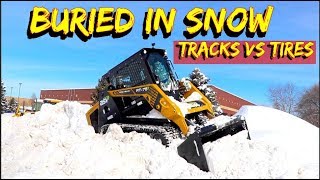 Tires or Tracks on a skid steer in Deep SnowCan you plow with a tracked loader [upl. by Naitsirhk]