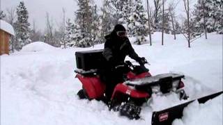 ATV Plowing 3 Feet of Snow Kawasaki Prairie 400 [upl. by Ahsikad]