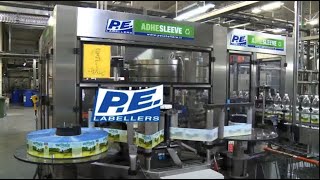 Beverage  ADHESLEEVE Labelling Machine  PE Labellers [upl. by Orhtej519]