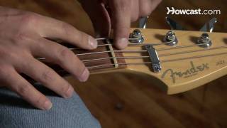 How to Restring a Bass Guitar  Guitar Lessons [upl. by Aratihc]