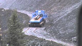 In Action2013 Foremost Husky 8 tracked hauler on Wildfire 3km hill  Pretium Resources Inc [upl. by Nauwaj760]