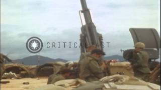 An M114 155 mm howitzer in operation and men help a soldier knocked down at Fire HD Stock Footage [upl. by Halliday]