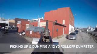 Hooklift Truck Picking Up amp Dumping a 12 yd Rolloff Dumpster [upl. by Eeslek357]