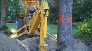 Backhoe Digging Out Stump [upl. by Arolf]