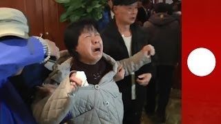 Malaysian plane shock Families of MH370 passengers react to news about crashed jet [upl. by Emarej]