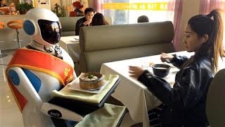 In Beijing Robot Waitresses Are Happy to Serve [upl. by Urbannai]