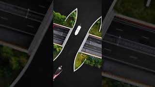 Drone Footage Disappearing bridge carries boats across Dutch motorway [upl. by Perzan994]