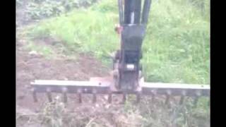 home made rake for mini digger 12610wmv [upl. by Essilrahc]