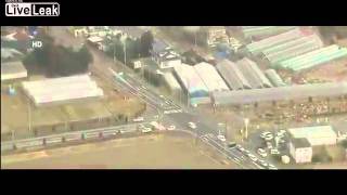 Aerial view of tsunami striking Sendai Japan [upl. by Shivers]