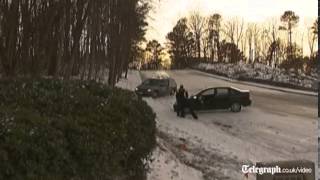 Cars spin out of control on downhill icy road in US [upl. by Savick]