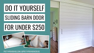 DIY Sliding Barn Door for Under 250 [upl. by Dnomhcir]