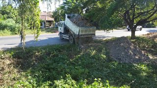 New Project Techniques Filling Land by Small Dump Truck 5Ton and Small Dozer Push Soil next road [upl. by Yrbua953]