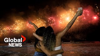 New Years 2023 Copacabana beach sizzles in Rio de Janeiro as fireworks illuminate night sky [upl. by Uda438]