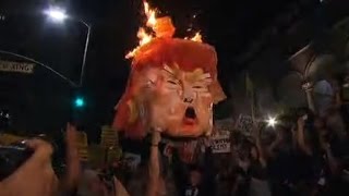 Trump effigy burned by protesters [upl. by Edualcnaej]