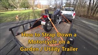 How to Strap Down a Motorcycle on a Garden or Utility Trailer [upl. by Atinehc]