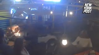 Jawdropping video shows woman plow golf cart through restaurant as diners dive out of her way [upl. by Neerod]