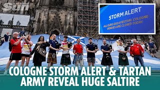 Cologne storm alert closes fan zones amp Tartan Army reveal huge Saltire outside cathedral [upl. by Wolcott336]