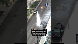 Water shoots out of manhole in Chicagos West Loop amid heavy rains flash flooding [upl. by Suivatnom]