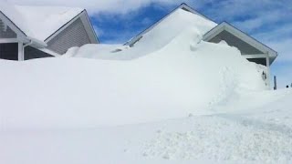 Jawdropping amounts of snow cover homes in New Brunswick community see it [upl. by Rayshell]