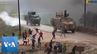 Civilians Throw Rocks at Turkish Military Convoy in Northwestern Syria [upl. by Einrae]