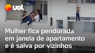 Mulher fica pendurada em janela no Guarujá e é salva por vizinhos veja vídeo [upl. by Galatia]