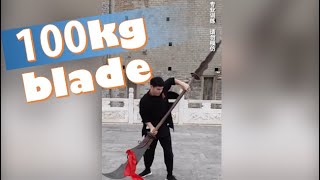 Young Chinese man shows off feat with 100kilogram blade [upl. by Neetsuj]