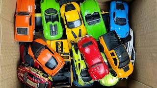 Box full of various miniature cars Peugeot Jaguar Pagani Hyundai Cadillac One Opel DHL [upl. by Ettereve]