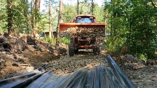 Building a new road in the woods Drainage stone dirty oversize and gravel Kubota L3940 Bobcat E35 [upl. by Bobbee448]