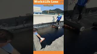 Roofers apply hot bitumen and felt layers for a durable waterproof longlasting roof [upl. by Anattar847]