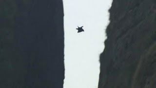 Jeb Corliss flies through a narrow crack in Mount Jianglang [upl. by Dupaix]