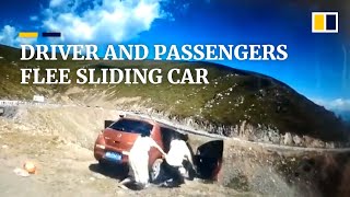 Driver passengers flee car before it slides down mountain in China [upl. by Klemens]