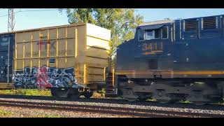 FALL TRAINS Fast CSX Freight 327 Rolls Through Pointe Claire EXO Station on CN [upl. by Annaihs]