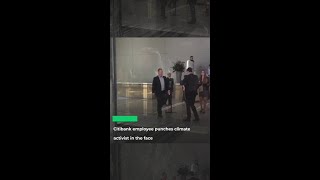 Citibank employee punches climate activist in the face [upl. by Latsyrd491]