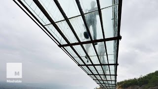 Take a 900Foot Walk Over a Gorge Via a GlassBottomed Bridge  Mashable News [upl. by Sivatco177]