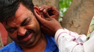 Ear Waxing  Traditional ear cleaner in India [upl. by Anneuq]