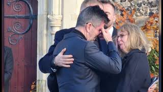 Liam Paynes parents console Simon Cowell outside One Direction singers funeral [upl. by Matuag238]