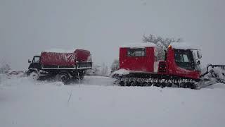 Pisten Bulley rescue Unimog in deep snow [upl. by Ferrigno]