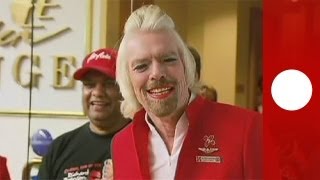 Virgin Group founder Richard Branson works as stewardess for a day [upl. by Ainirtak]